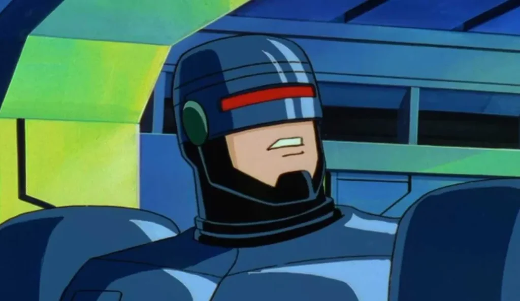 Animerad karaktär RoboCop sitter i förarsäte med blå rustning, röd hjälmstrimma och grön visor över ögonen.